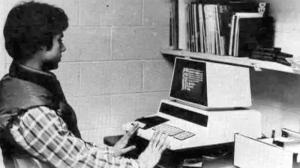 Old photograph of a man working with a Commodore PET computer.